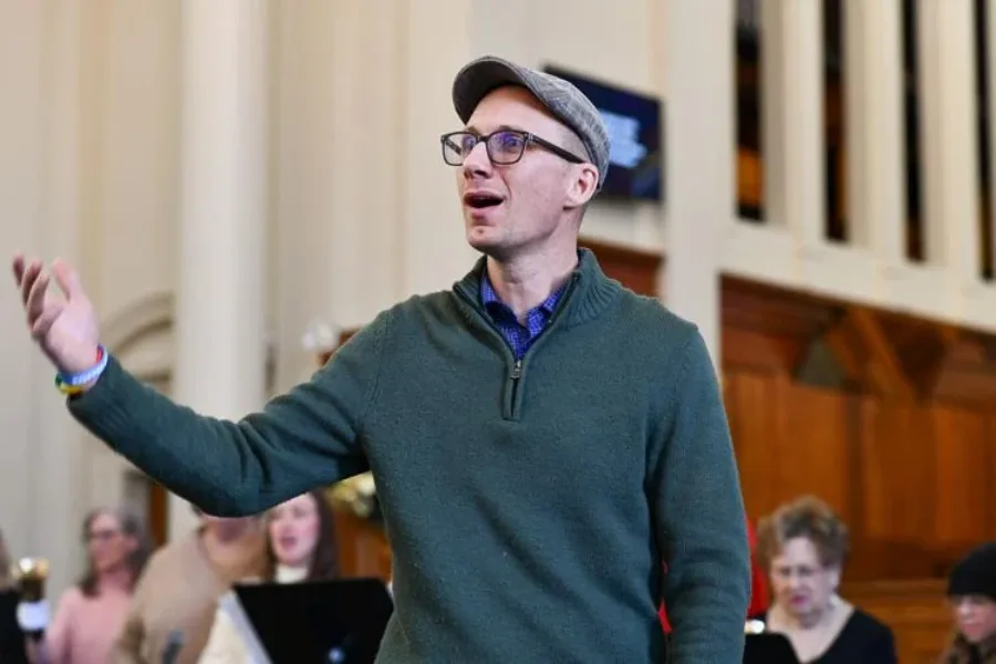 Matt Headley conducting the handbell choir